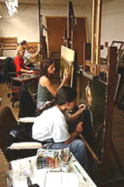 Several artists restroing paintings